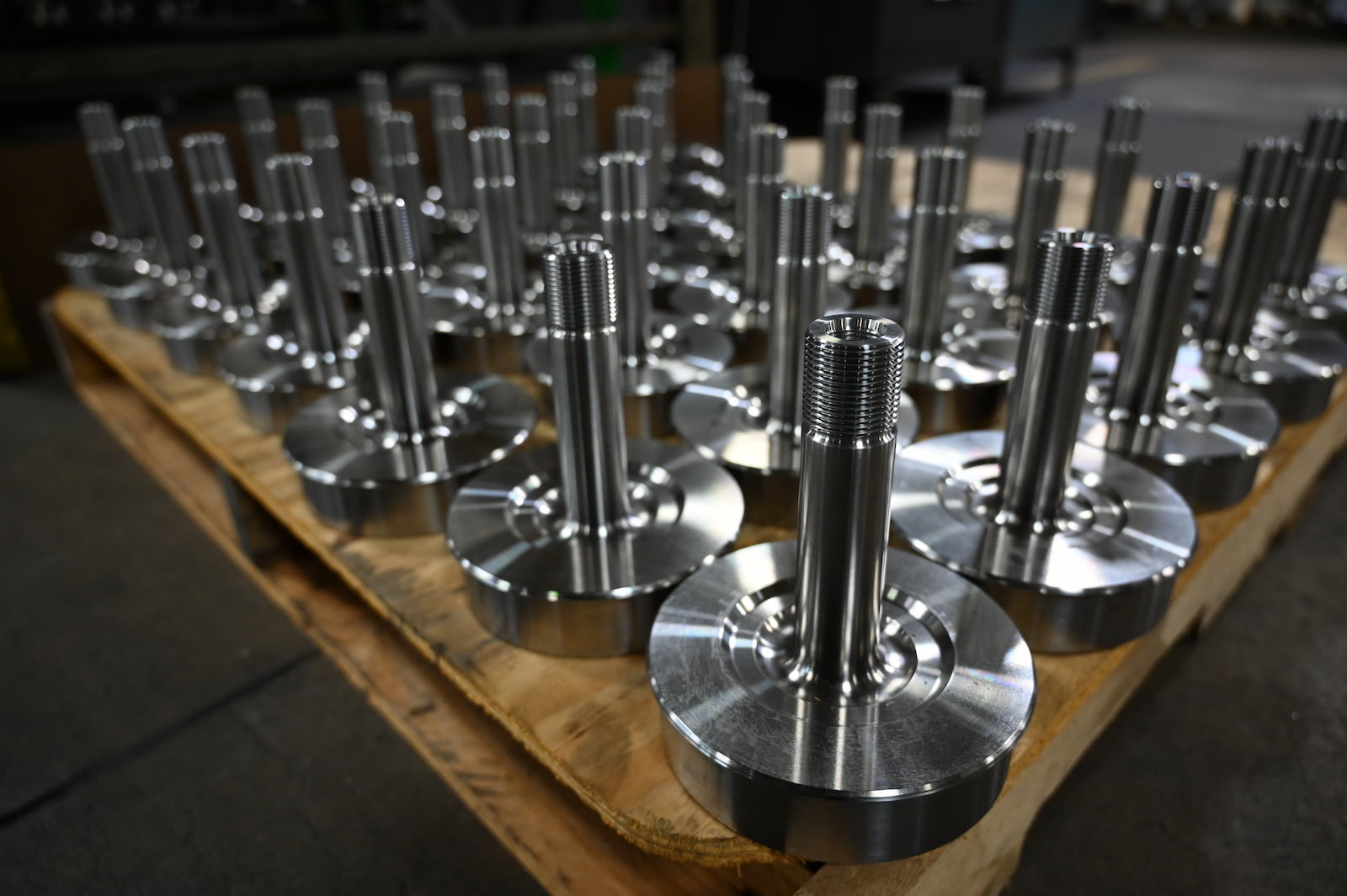 A large order of CNC machined parts on a pallet