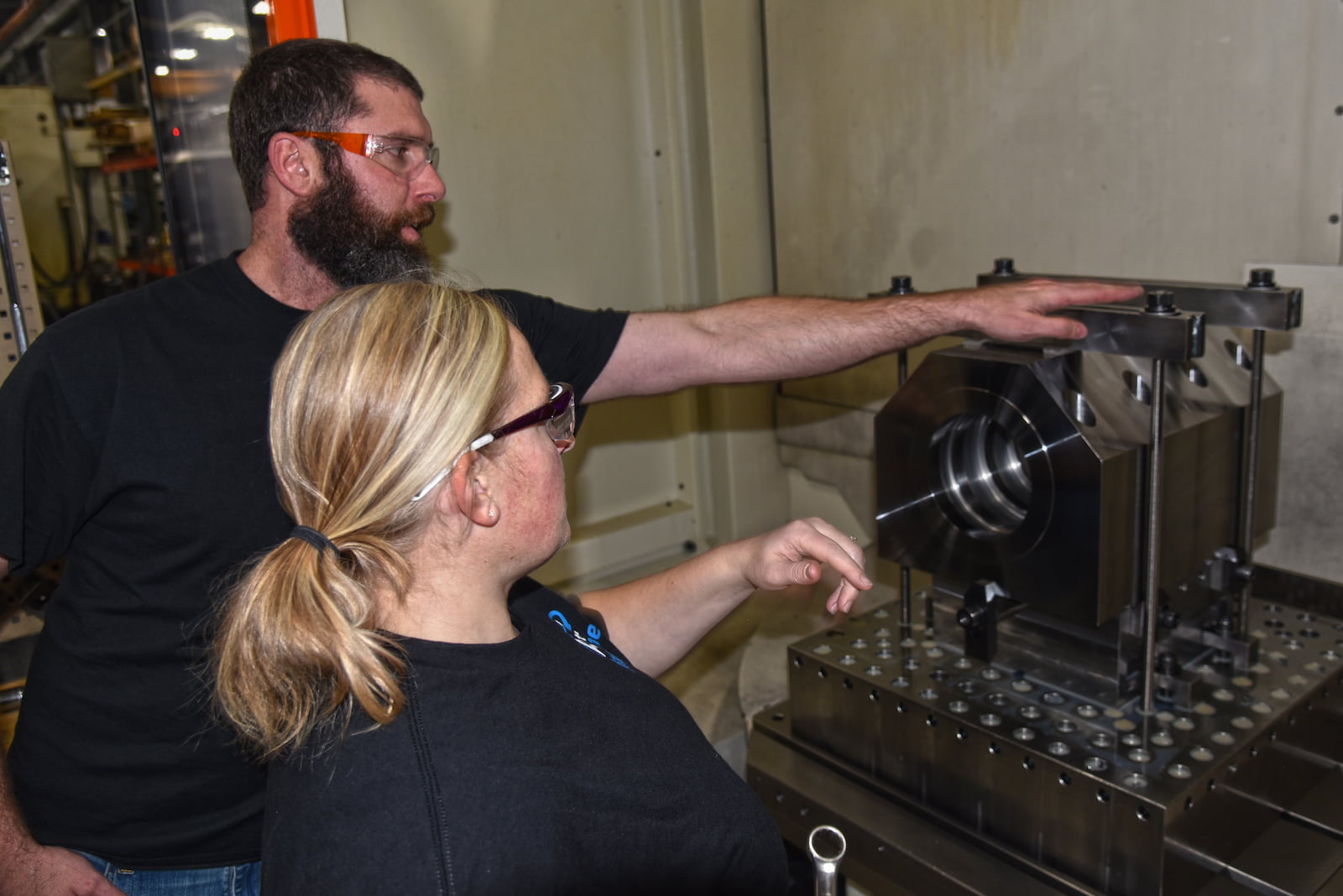 An A to Z Machine employee training another